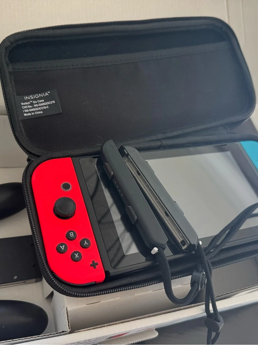 Nintendo Switch with Red and Blue Joy‑Con and Carry Case Not used much!